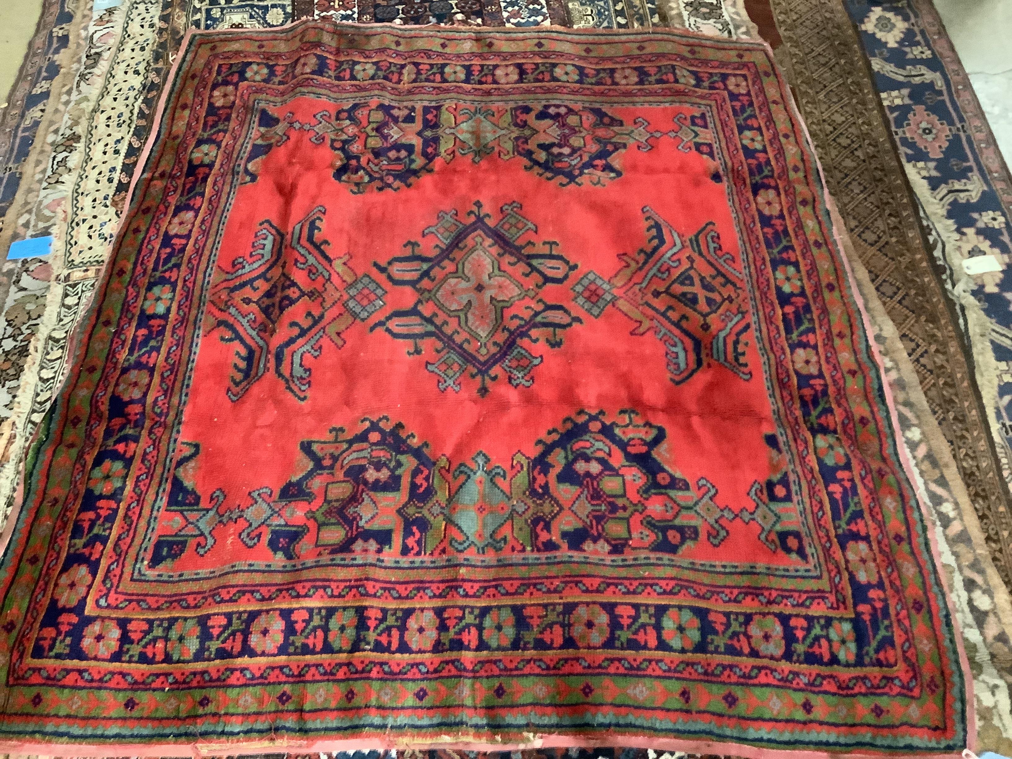 A Turkish Oushak red ground carpet, 207 x 181cm